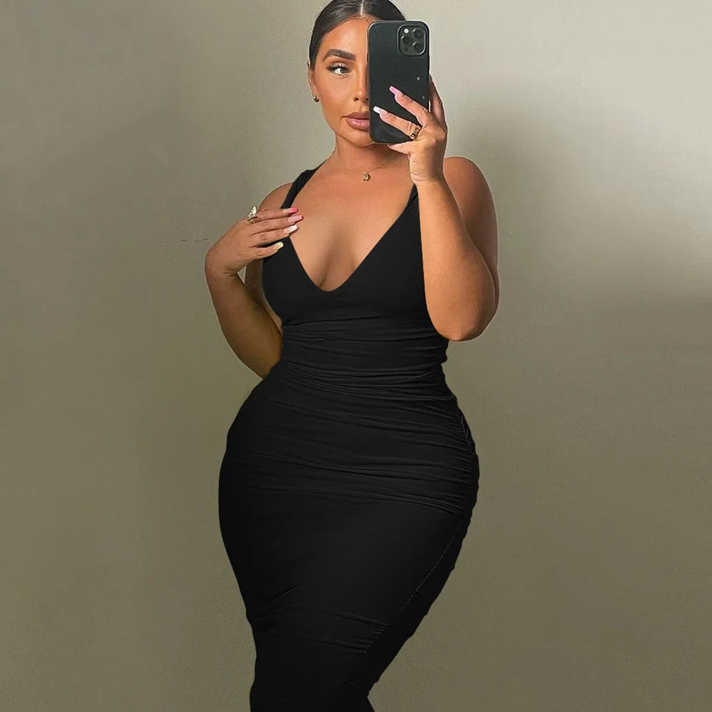 A slimming, sleeveless, sexy V-neck, slit back, solid color body-hugging dress