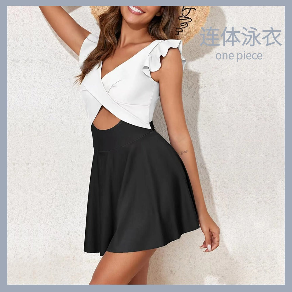 One-piece swimming suit with frilled cross-shaped skirt design