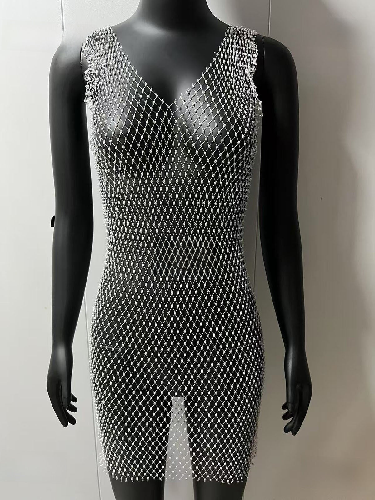 V-neck dress with a cut-out fishing net mini skirt